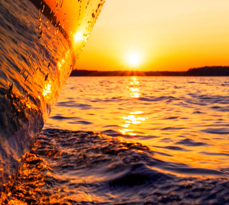 Boat on the water during a golden sunset